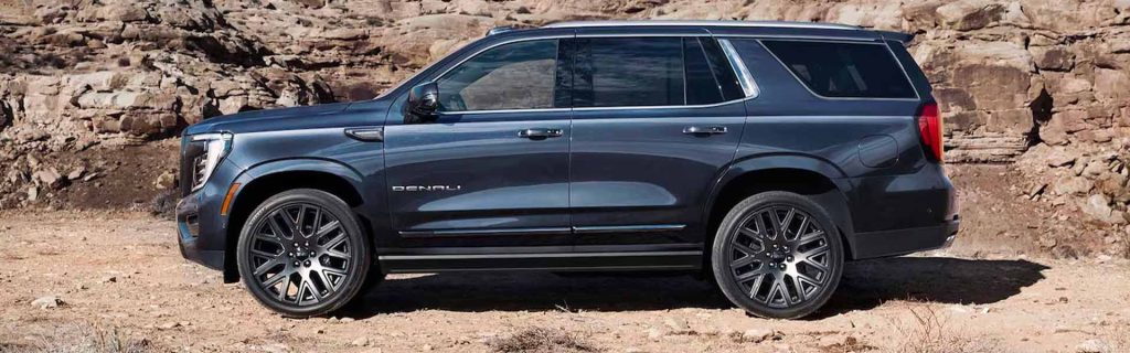 2025 Yukon parked in front of some rocks